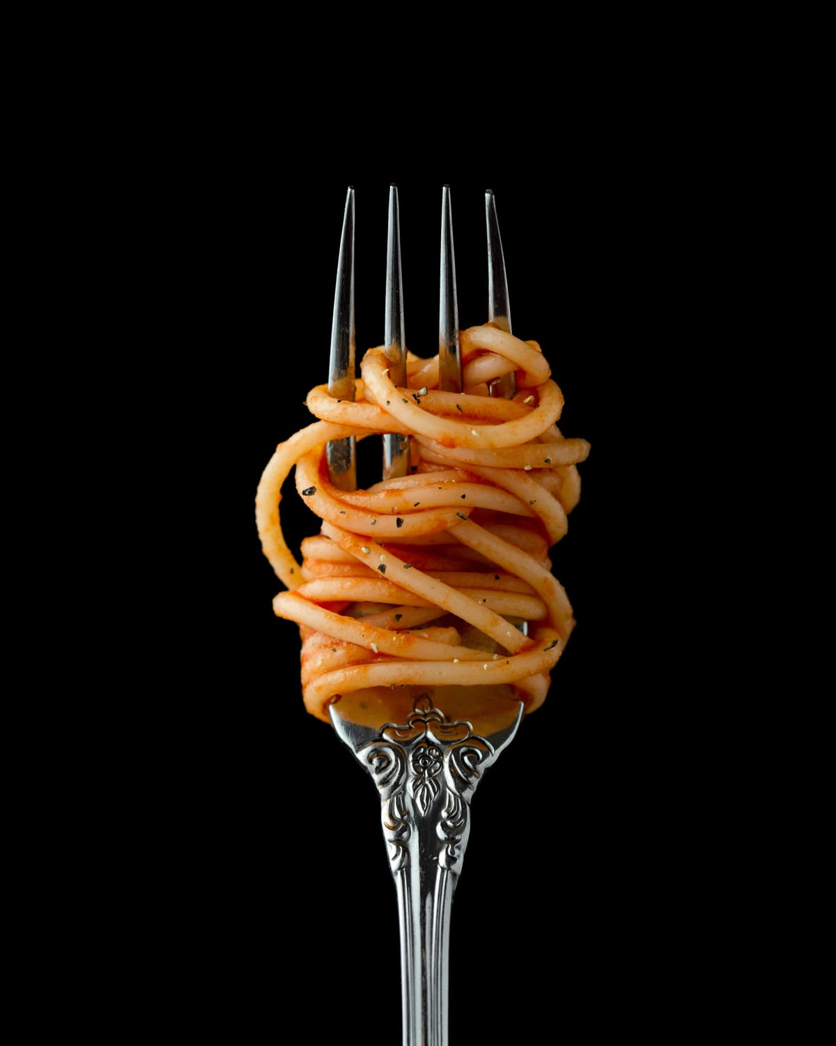 Pasta dish on beautiful fork, feminine meal